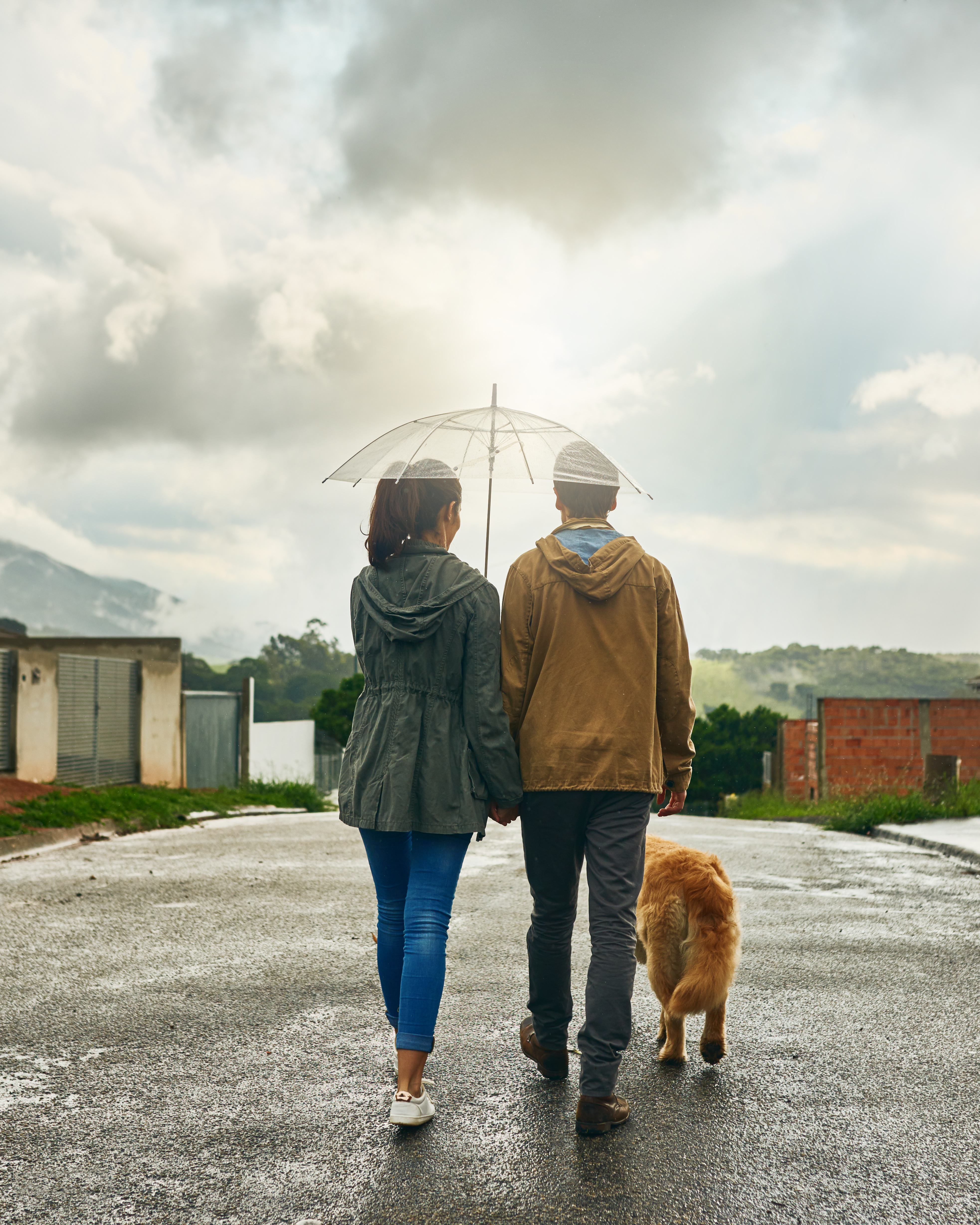 A couple walking their dog together